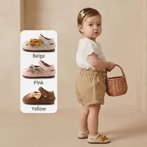 Adorable baby girl soft-sole toddler shoes featuring cartoon kitten and bow details