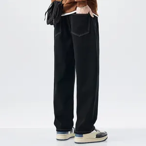 Back view detail showing men's black straight-leg thin denim jeans for summer style