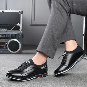 Close-up of men's black low-top casual leather shoes with stylish decorative stitching