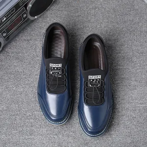 Top-down detail of navy blue men's casual slip-on leather shoes with sport labels