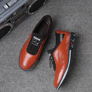 Detailed top view of brown leather slip-on casual shoes with black elastic laces