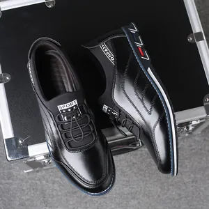 Sleek black slip-on men's leather shoes with embroidered accents and color-block sole.
