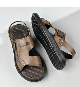 Detailed view of brown men's sandals with textured non-slip sole and embossed logo.
