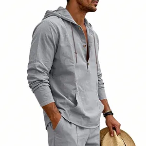 Detail of a men's gray linen long-sleeve hooded Henley shirt with casual holiday style
