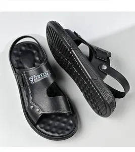 Detailed macro view of black men's sandals with textured strap and anti-slip sole