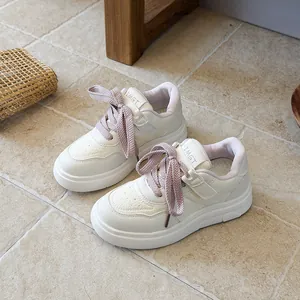 Stylish white children's sneakers with lavender laces and chunky anti-slip rubber sole