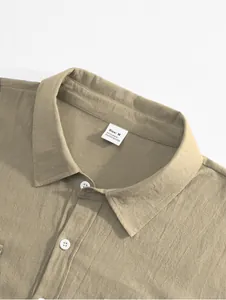 Close-up detail of khaki cotton linen men's shirt showing fabric texture and size label