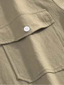 Close-up of a khaki cotton linen shirt pocket with a white button detail