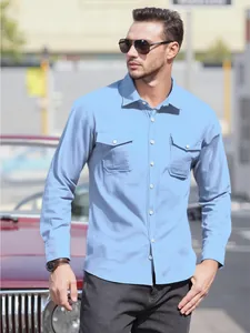 Men's light blue cotton linen shirt with double pockets in casual outdoor setting