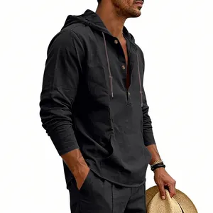 Detail shot of men's black linen hooded Henley shirt with drawstring and buttons.