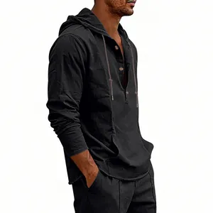 Detailed side view of a men's black linen hooded Henley shirt with kangaroo pocket