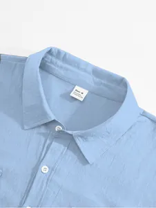 Detail view of light blue linen-blend shirt collar showing size and material label