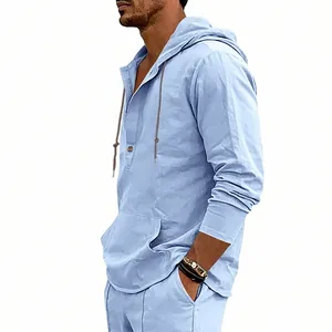 Close-up detail of a light blue linen hooded Henley shirt for men's casual wear.
