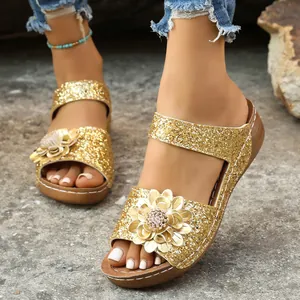 Sparkly gold glitter wedge sandals for women featuring an elegant 3D flower decoration