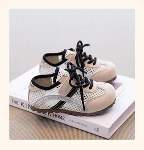 Detailed view of breathable mesh kids sneakers with suede overlays and classic laces.