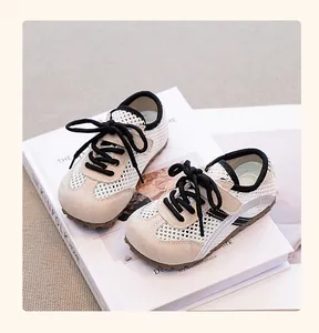 Close-up view of breathable mesh toddler girl sneakers featuring beige suede details