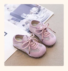 Close-up of purple toddler mesh sneakers with breathable fabric and suede details