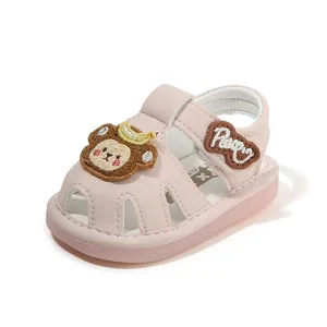 Cute pink cartoon monkey baby sandals with soft anti-slip soles and toe protection design.