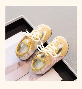 Close-up detail of girls' breathable mesh sneakers featuring yellow and pink patchwork