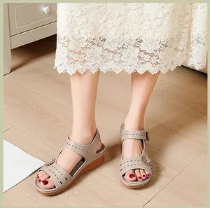 Comfortable womens grey wedge sandals with floral applique and hollowed out straps