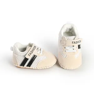 Close-up of breathable mesh baby walking shoes with soft soles and stripe detail.
