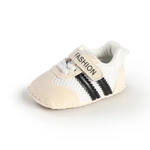 Close-up of breathable mesh baby walking shoes with black stripes and FASHION strap