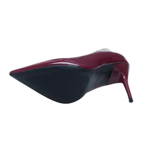 Detailed bottom view of elegant burgundy patent leather stiletto high heel shoe