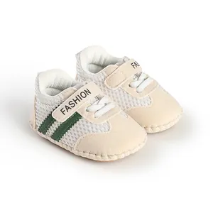 Breathable mesh baby walking shoes with soft soles and green stripes detail view