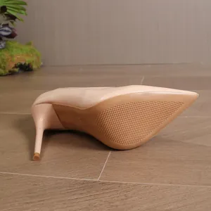 Detailed view of elegant nude pointed-toe stiletto pumps with anti-slip sole for women.