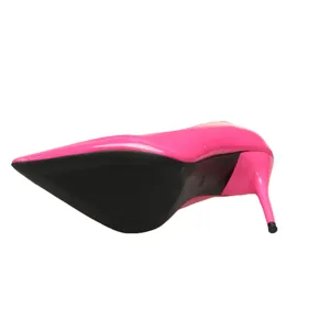 Detailed view of the black sole and stiletto heel of a pink pointed-toe pump.