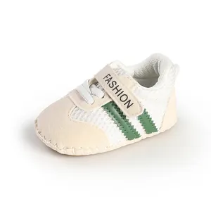 Close-up of breathable mesh baby shoes with soft soles and stylish green stripe detail