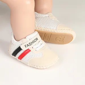 Detail of breathable baby walking shoes with soft non-slip soles and mesh fabric.
