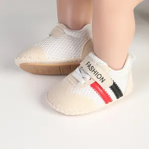 Detailed view of breathable mesh baby walking shoes with soft soles and striped design