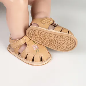 Detail of soft-sole baby sandals with flower embroidery and anti-slip rubber outsole