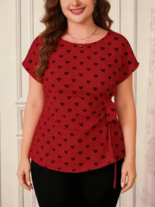 Plus size red short sleeve top featuring black heart print and side tie detail