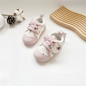 Sweet pink baby girl walking shoes with cute strawberry pattern and soft soles
