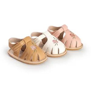 Infant baby walking sandals with soft soles and delicate floral embroidery details
