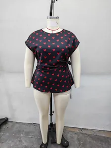 Detail of plus size short sleeve top with red heart print and side waist tie