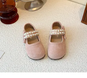 Elegant pink girls' Mary Jane shoes with double pearl straps and bow details.