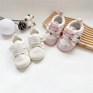 Soft sole baby girl walking shoes with floral and cherry patterns and velcro straps