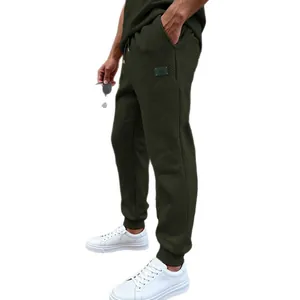 Pantalones de chándal con textura de gofre para hombre en verde oliva y corte holgado