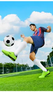 Detail of high-performance breathable green TF stud soccer shoes in action on turf
