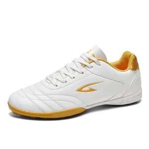 Professional breathable white and gold TF turf soccer shoes for training and competition
