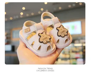 Pink soft-sole leather baby sandals with cute bear patch for infants aged 0 to 2