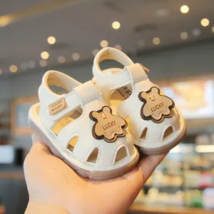 Cream baby soft sole sandals with cute bear design for toddlers aged 0-2 years
