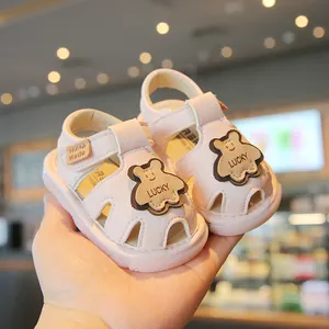 Pink toddler soft sole sandals featuring cute bear patches and anti-slip bottoms
