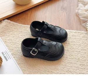 Close-up of black British style leather Mary Jane shoes for girls