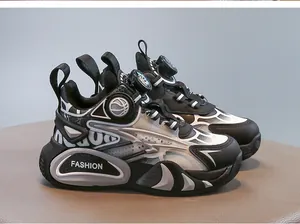 Close-up detail of boys' functional sneakers with black and white rotary buckle