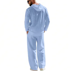 Back view of a men's light blue casual linen hooded shirt and matching loose trousers