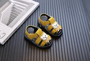 Yellow cartoon bear sandals for baby boys with soft soles, perfect for infant toddlers.